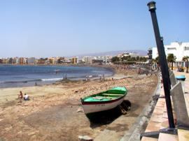 The beach at Arinaga is a popular destination for Spanish families at the weekend