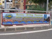 Our sign is on the Left of the roundabout, in front of the Petrol Station in Arinaga